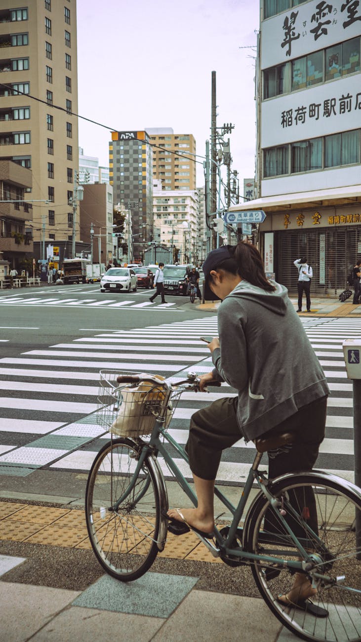 casual urban scene in tokyo japan with cyclist